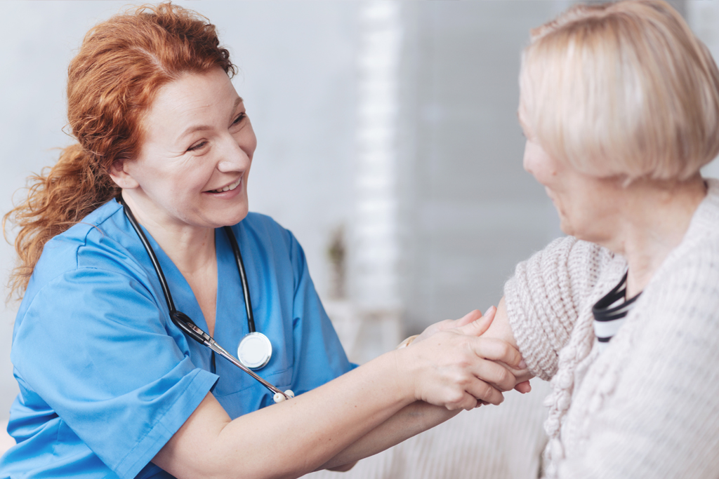 Nurse happily communicating with patient