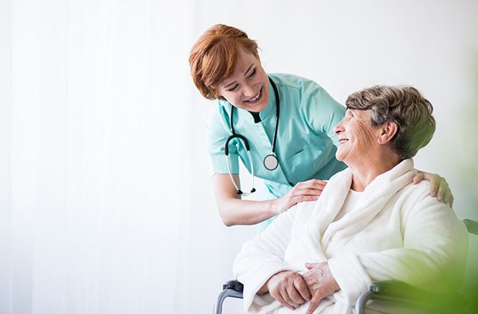 Nurse happily communicating with patient
