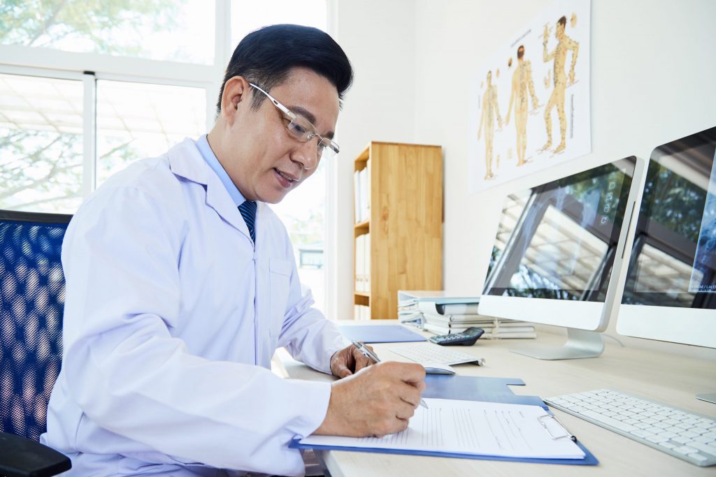 Doctor Doing Paper Work