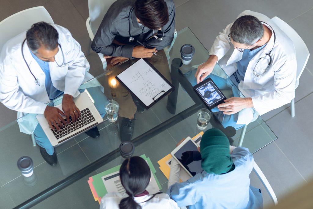Medical team working together at table in hospital