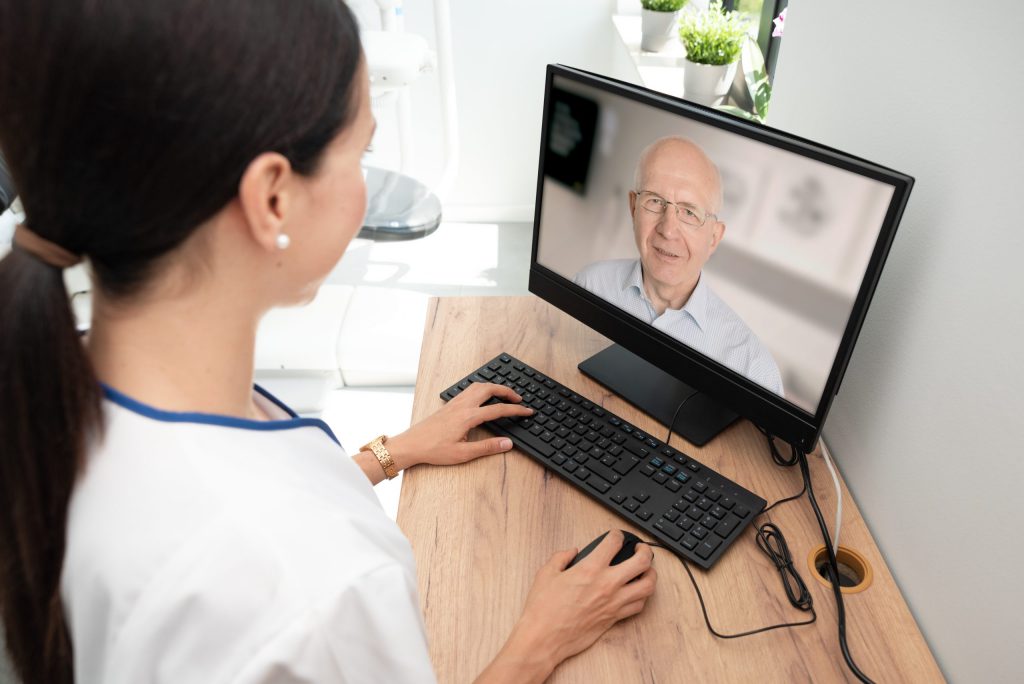 Nurse consulting Patient via Telehealth during COVID-19