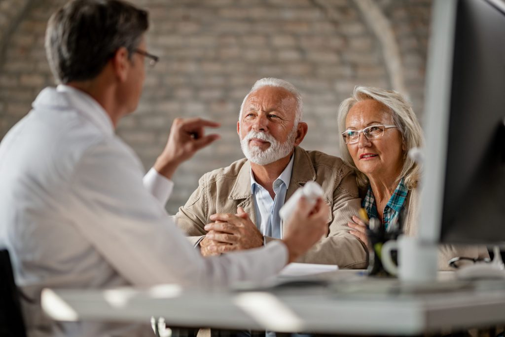 Physician gives instruction to couple