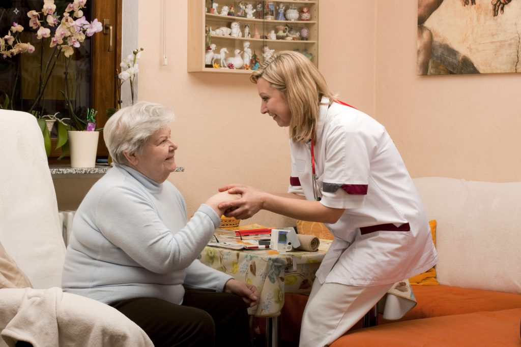Wound Care nurse Tending to Elderly Patient