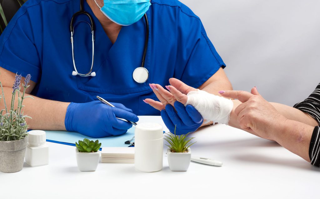 Doctor Checking Patient's Wound Stage