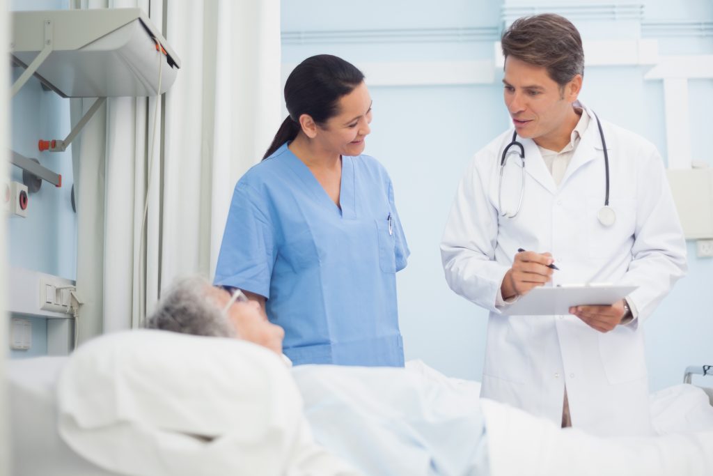 Doctor and Nurse Communicating with Patient