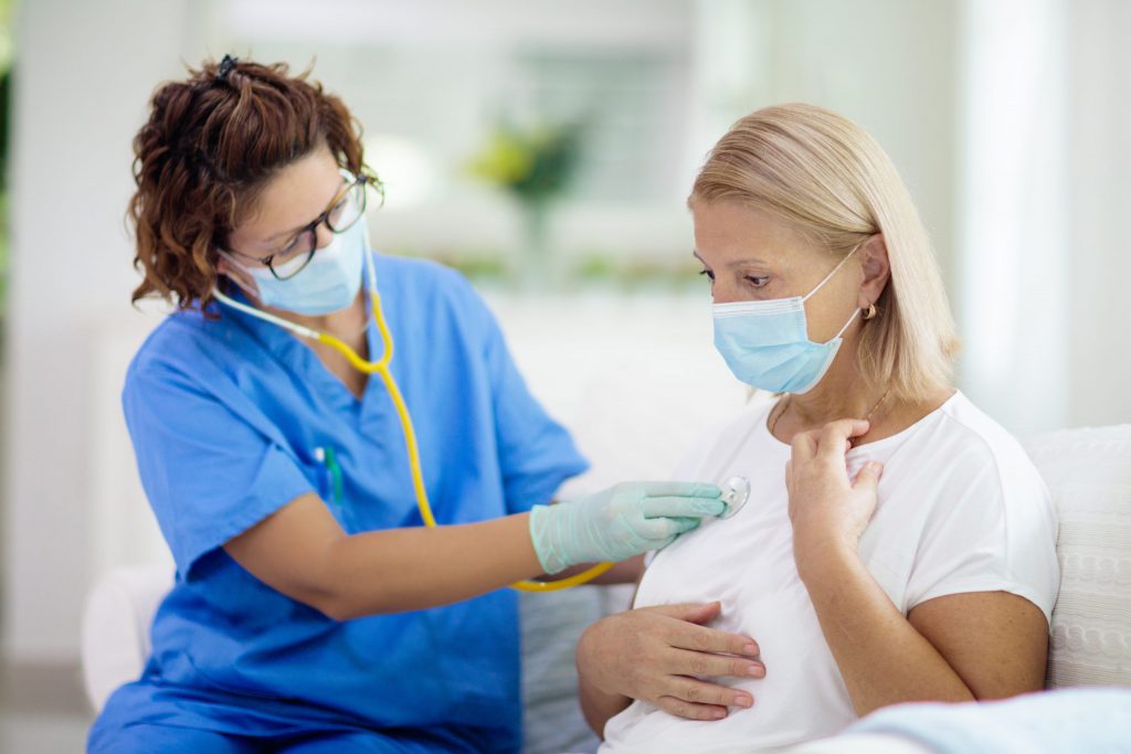 Physician checking Patient with Medical Stethoscope