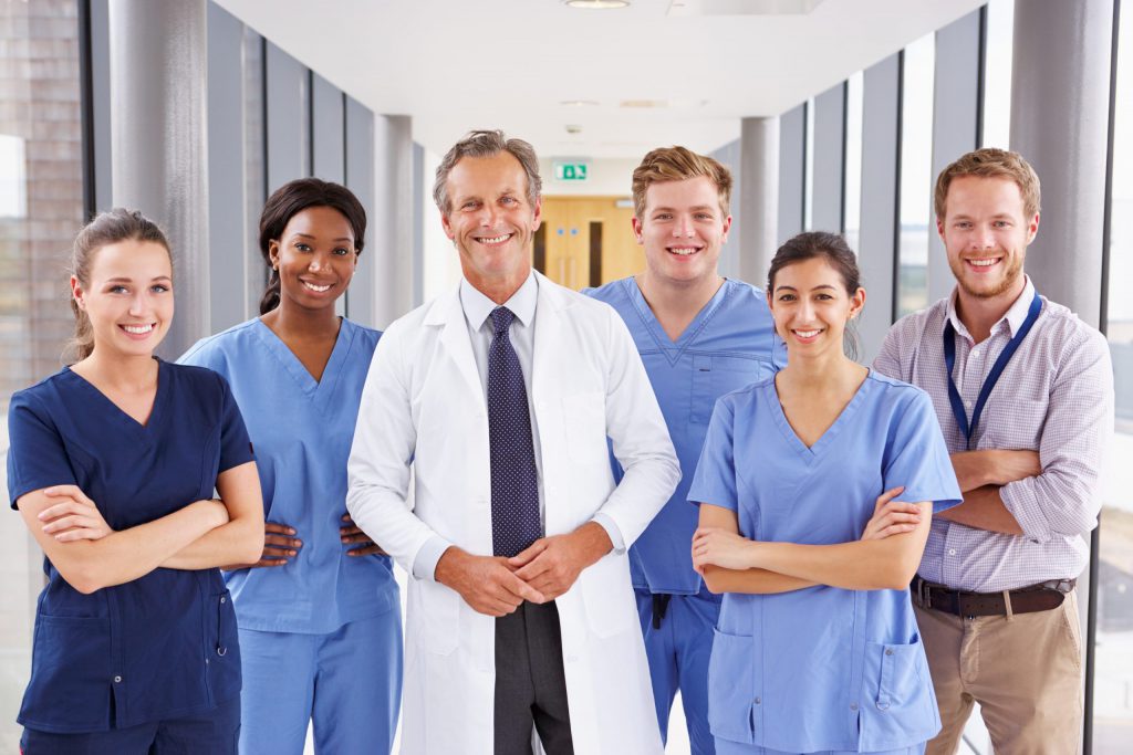 Group of Doctors and Nurses standing in Hospital