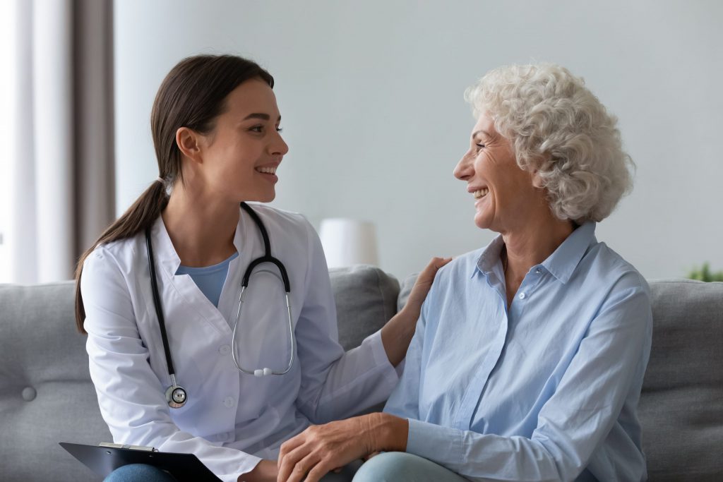 Nurse Happily Communicating with Patient