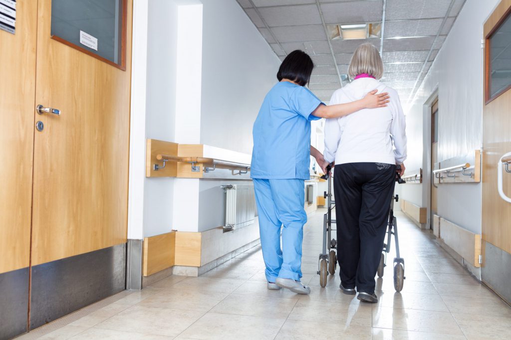 Nurse Taking Care of Elderly Patient