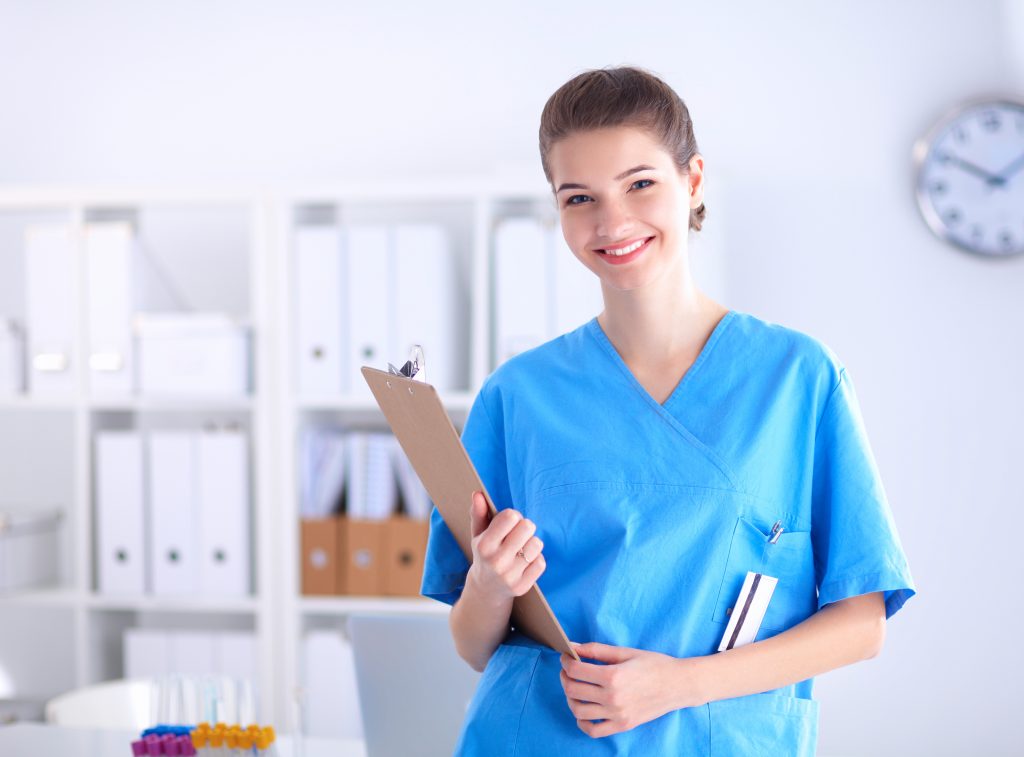 Nurse with smiling face standing in Hospital