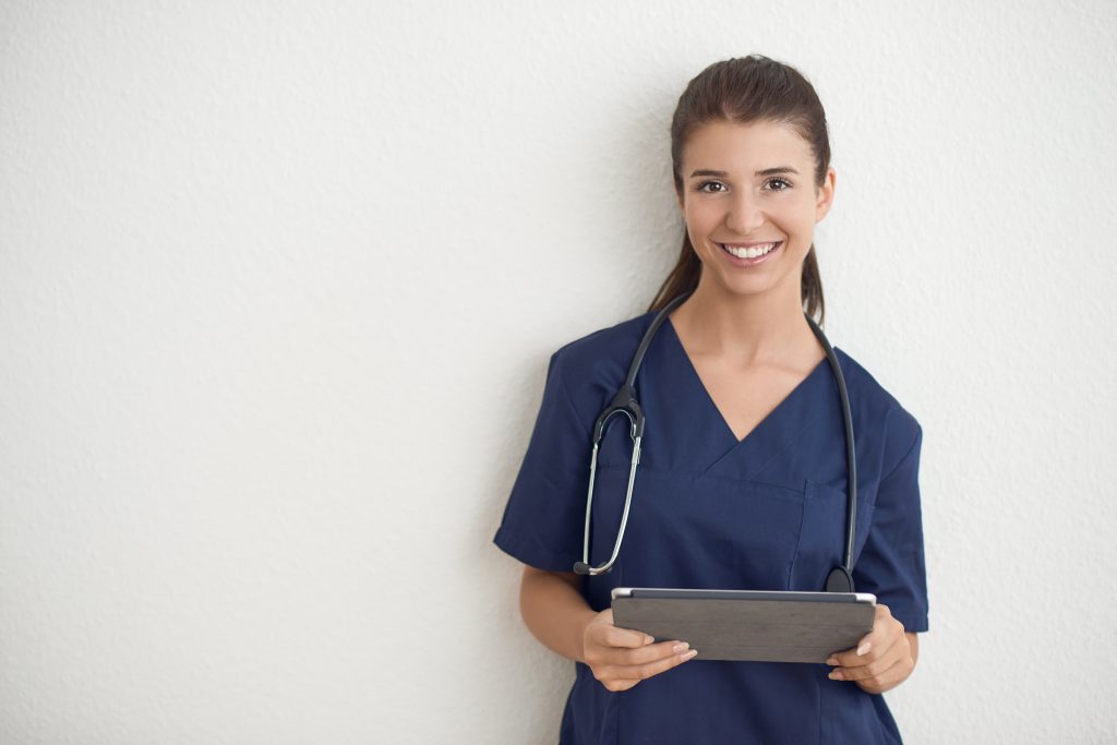 Nurse checking digital tablet