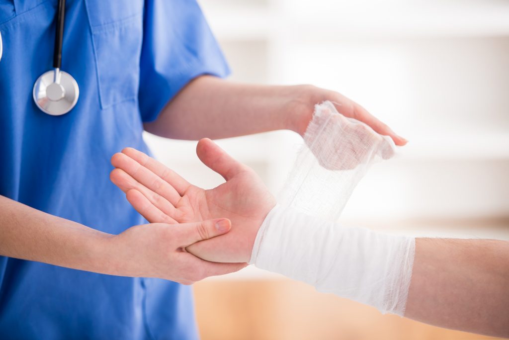 Nurse taking care of Patient's Wounded Hand