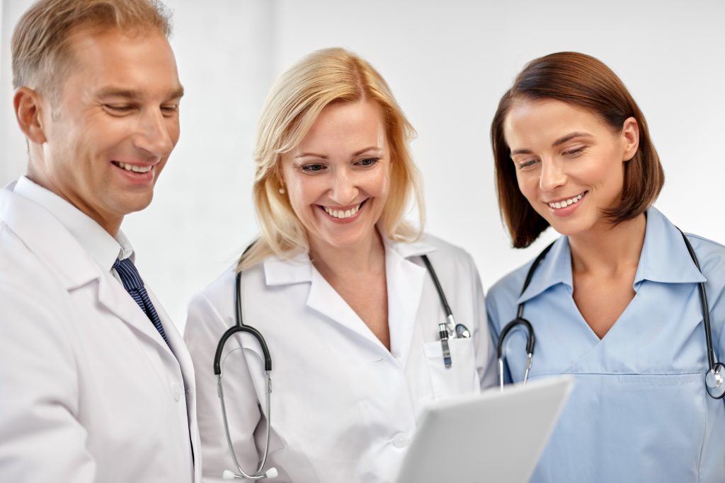 Medical Staff checking Digital Tablet