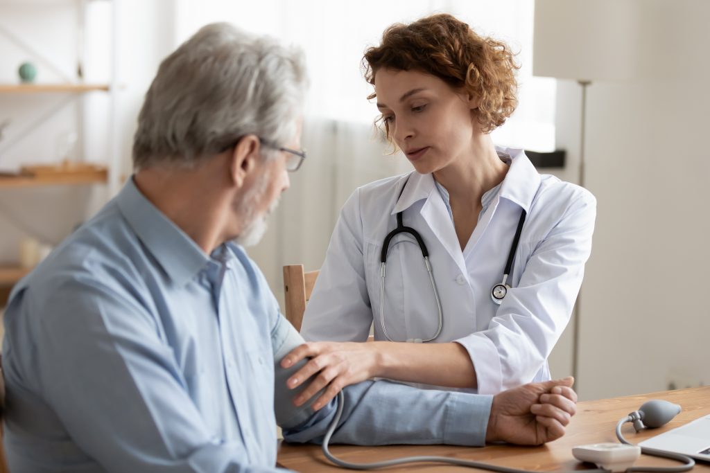 Nurse Checking Patient's Blood Pressure