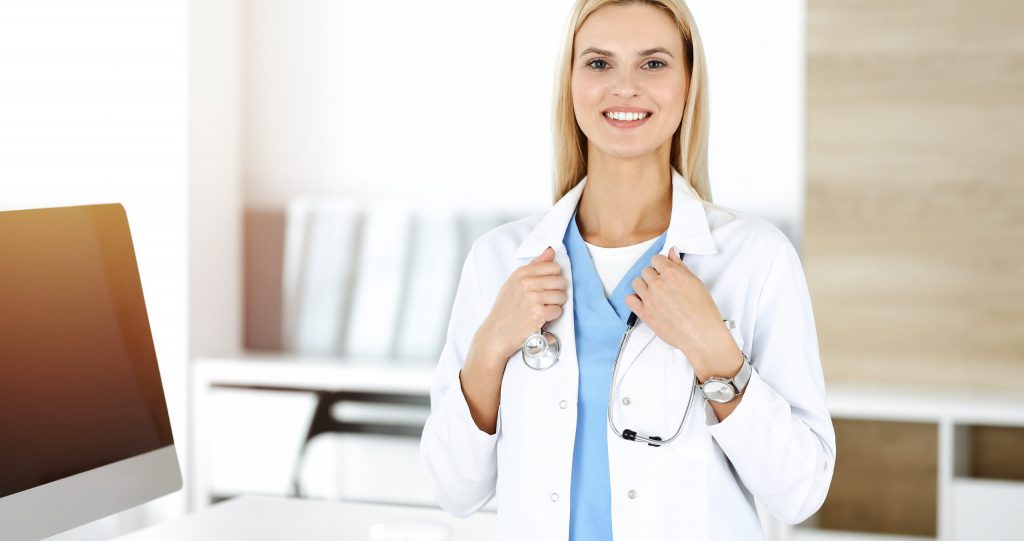 Physician with Smile & Medical Stethoscope
