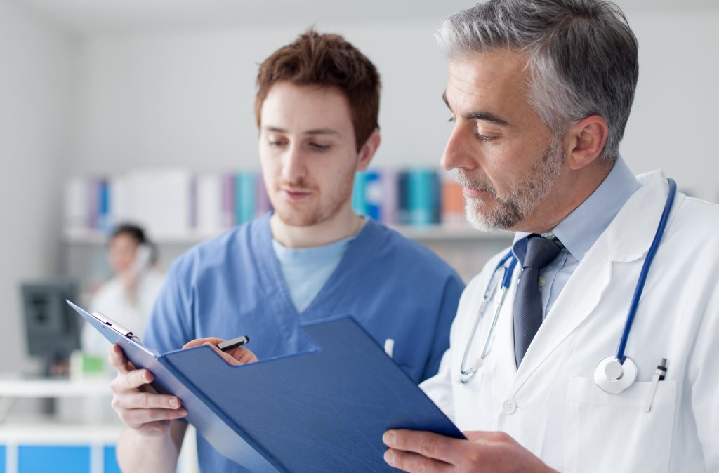 Physicians Discussing Medical Patient Records