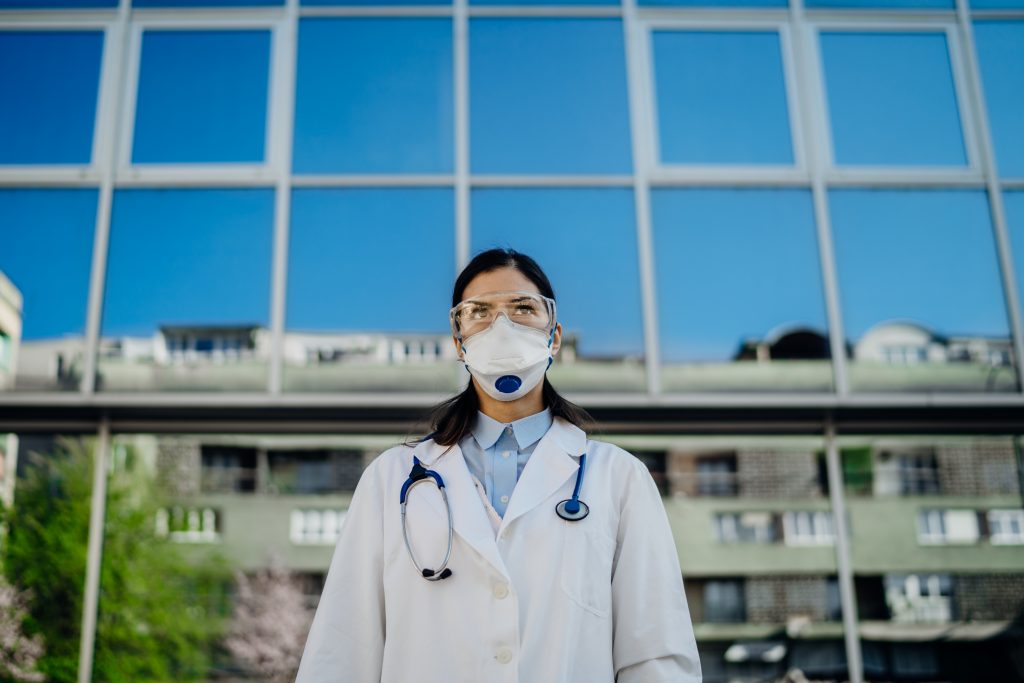 Female physician in Front of the Isolation Hospital