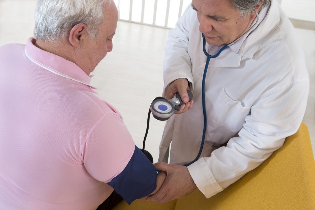 Doctor Checking Blood Pressure