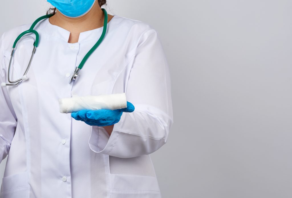 Doctor Holding Bandage