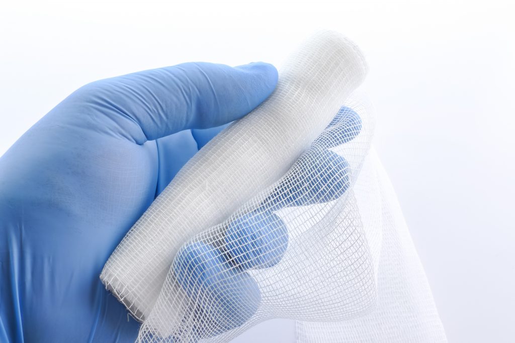 Hand holding Gauze